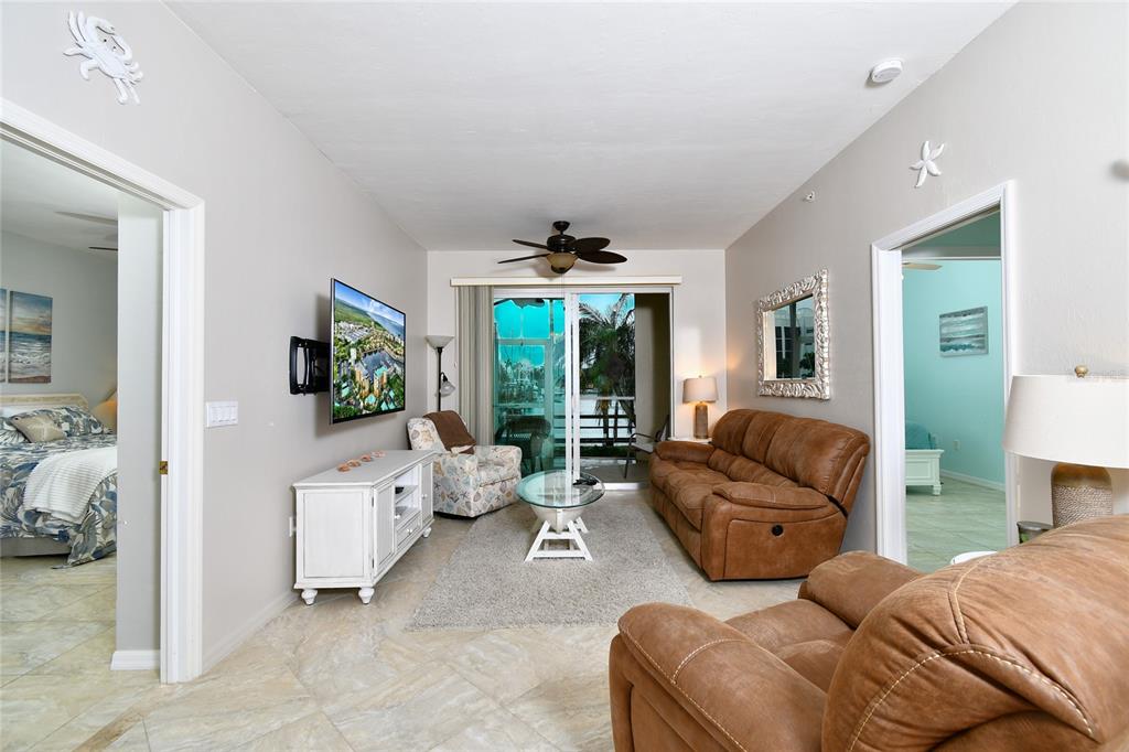 2060 Matecumbe Key Road, Unit 2102 Punta Gorda, FL 33955 - Photo 11 of 36 a living room with furniture and a large window