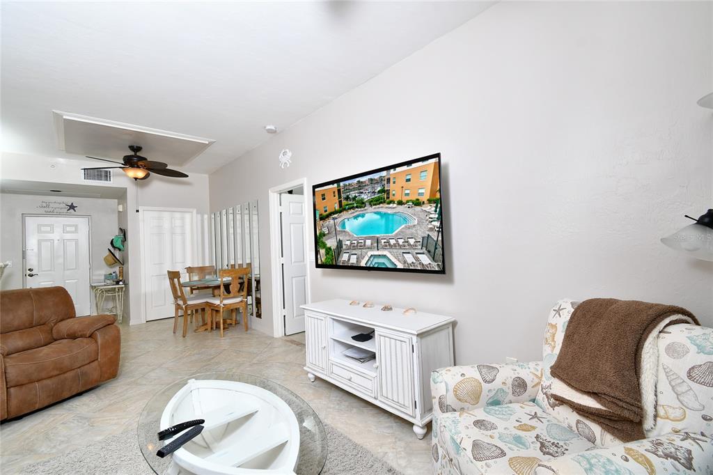 2060 Matecumbe Key Road, Unit 2102 Punta Gorda, FL 33955 - Photo 12 of 36 a living room with furniture and a flat screen tv