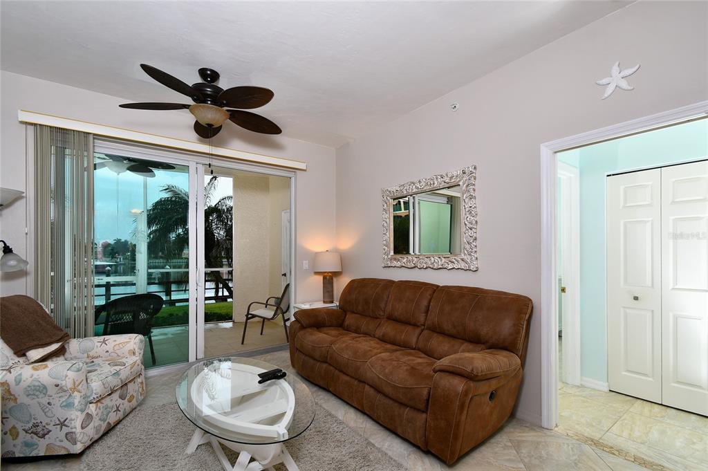 2060 Matecumbe Key Road, Unit 2102 Punta Gorda, FL 33955 - Photo 13 of 36 a living room with furniture and a large window