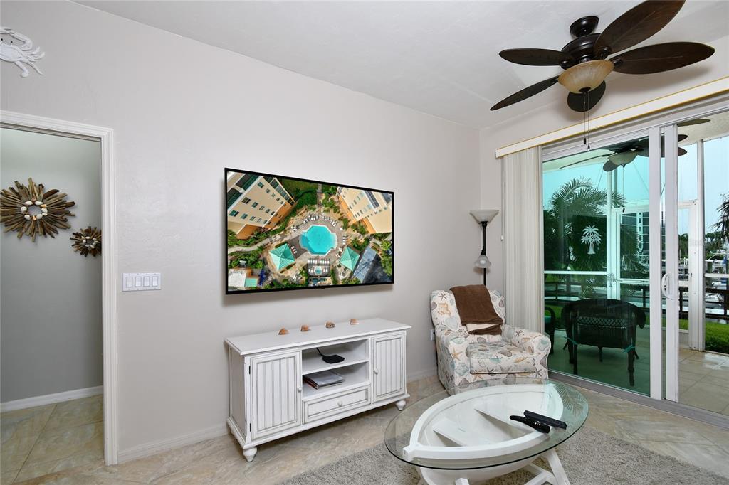 2060 Matecumbe Key Road, Unit 2102 Punta Gorda, FL 33955 - Photo 17 of 36 a living room with furniture and a flat screen tv