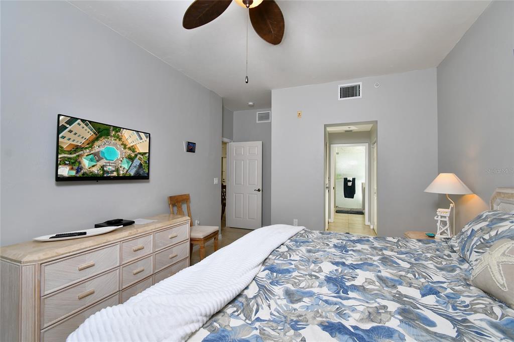 2060 Matecumbe Key Road, Unit 2102 Punta Gorda, FL 33955 - Photo 20 of 36 a bedroom with a bed and a flat screen tv