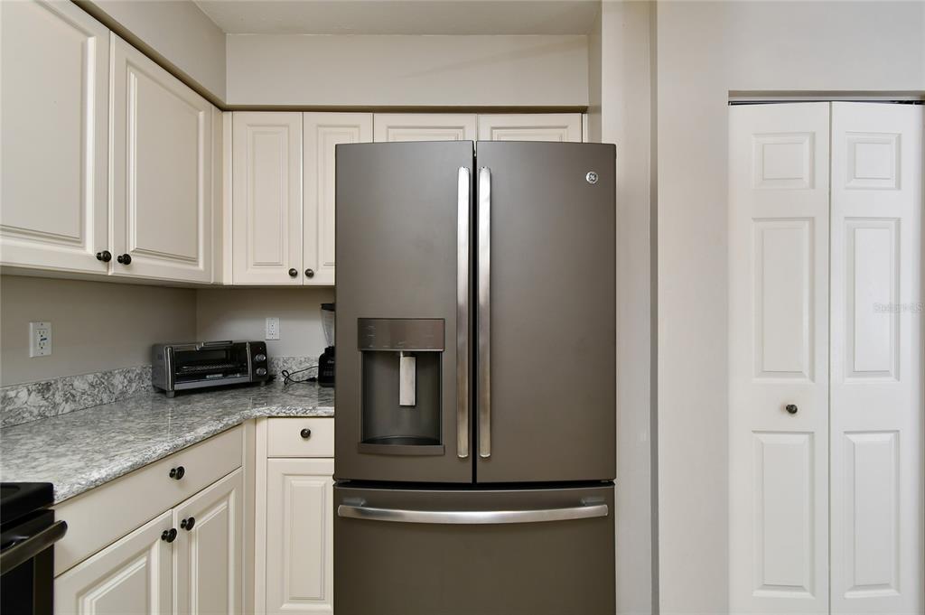 2060 Matecumbe Key Road, Unit 2102 Punta Gorda, FL 33955 - Photo 6 of 36 a kitchen with stainless steel appliances granite countertop a refrigerator and a stove