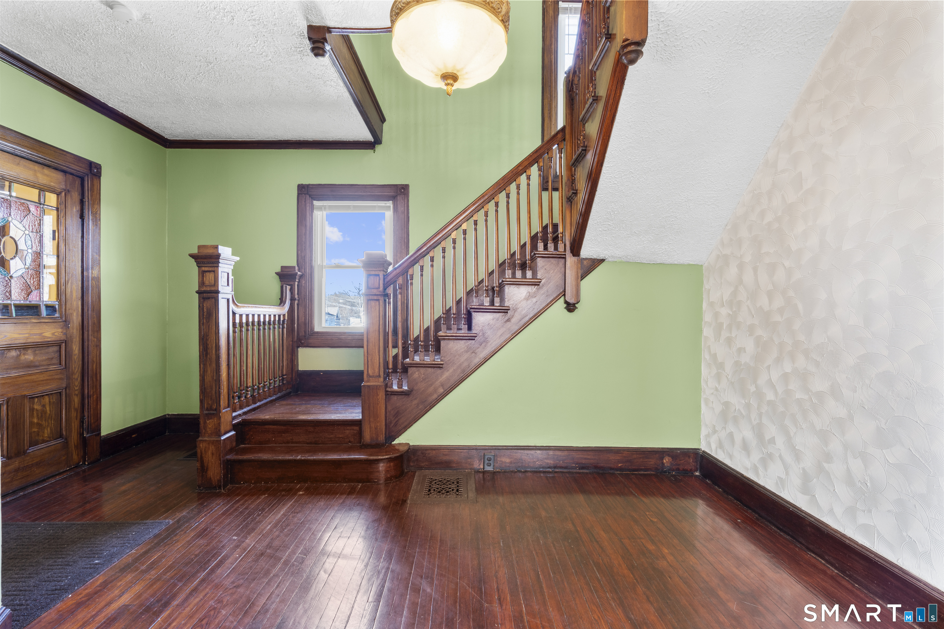 101 Wilcox Avenue Meriden, CT 06451 - Photo 20 of 43 a view of entryway with wooden floor and stairs