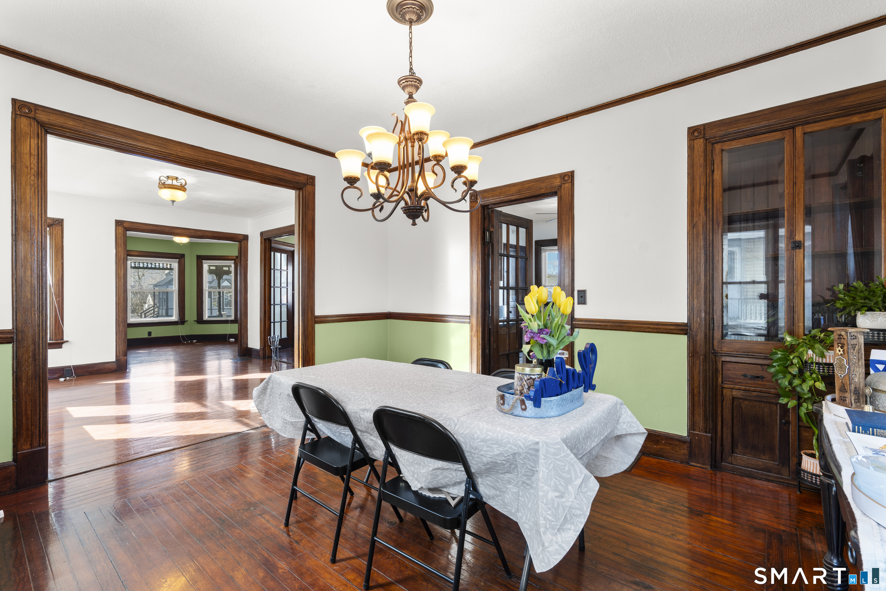 101 Wilcox Avenue Meriden, CT 06451 - Photo 23 of 43 a view of a dining room with furniture wooden floor and chandelier