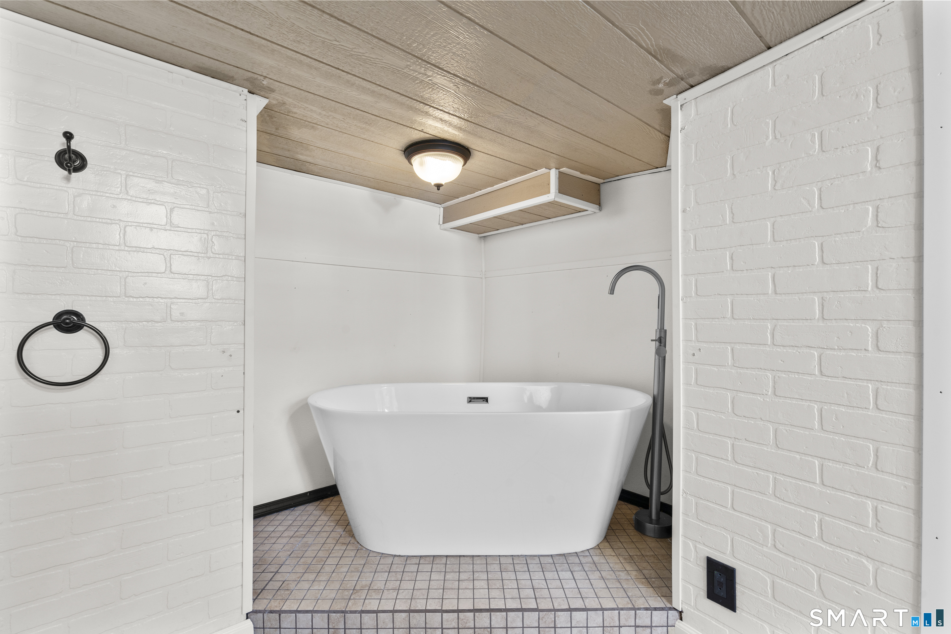 101 Wilcox Avenue Meriden, CT 06451 - Photo 25 of 43 a white bath tub sitting in a bathroom