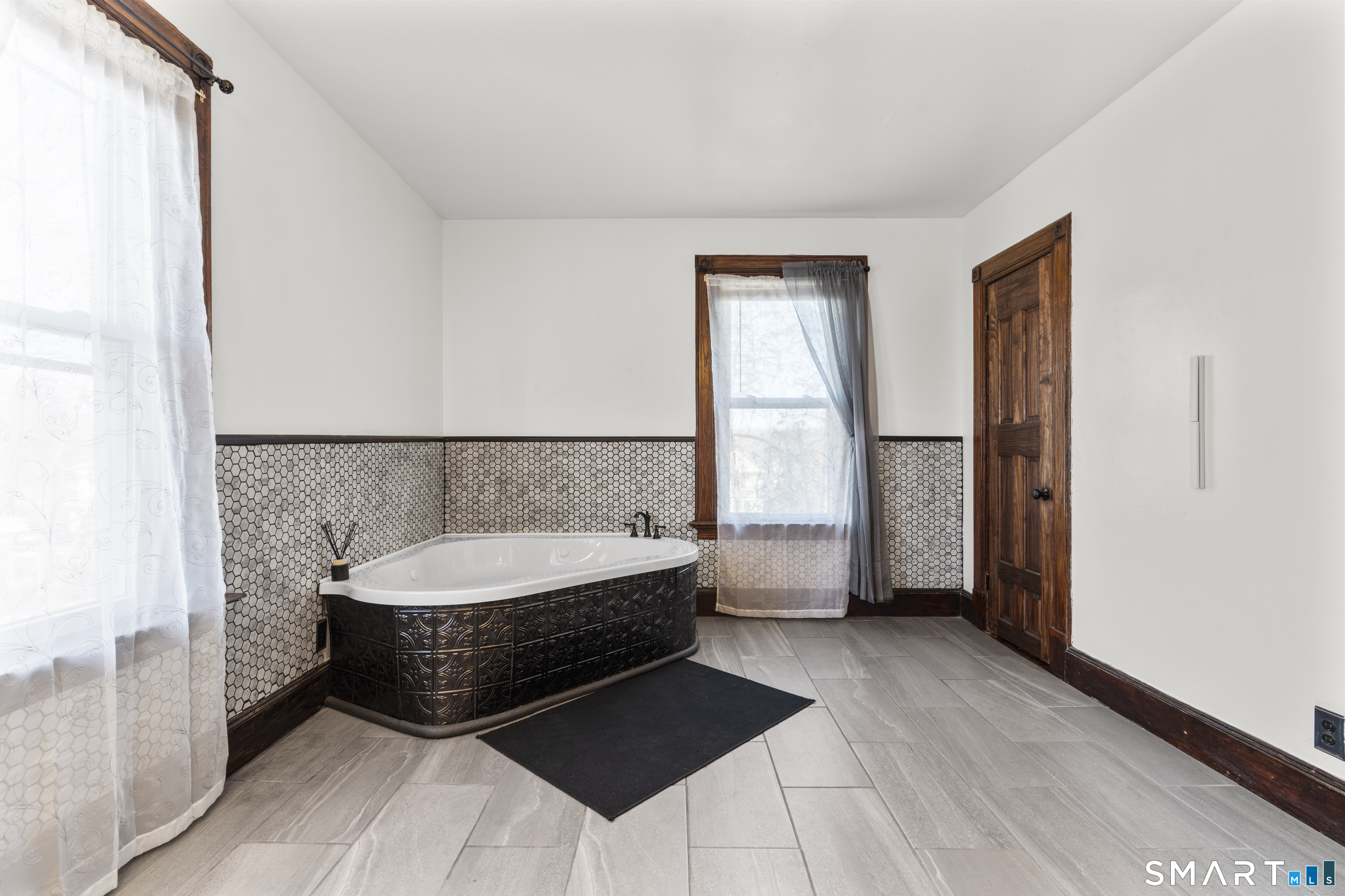 101 Wilcox Avenue Meriden, CT 06451 - Photo 26 of 43 a spacious bedroom with a bed and a window