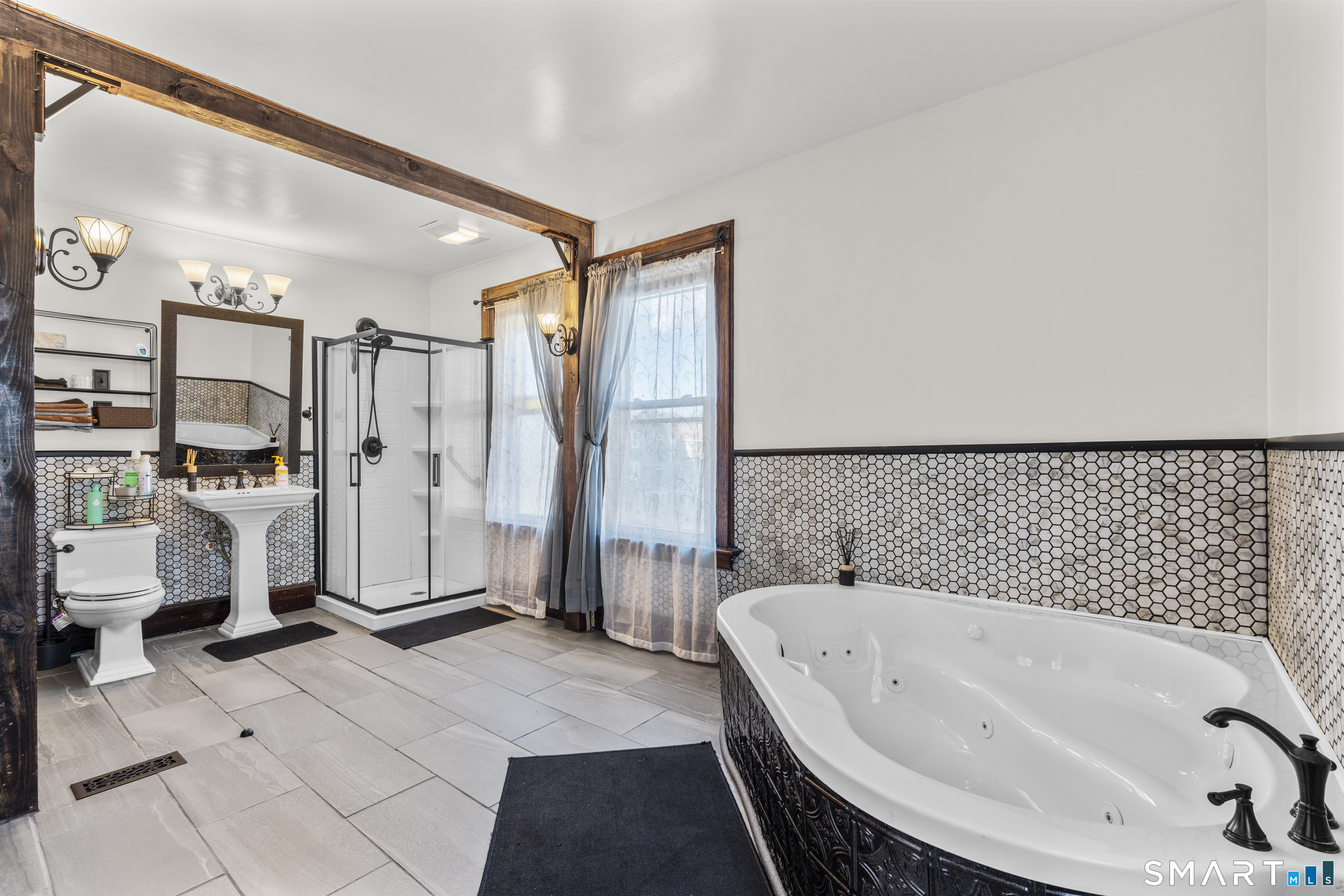 101 Wilcox Avenue Meriden, CT 06451 - Photo 28 of 43 a bathroom with a bathtub and a shower