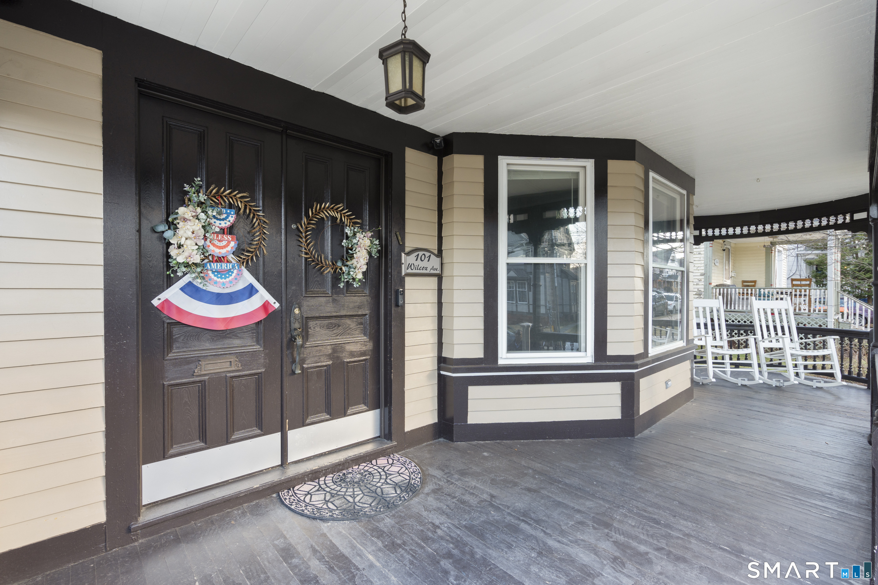 101 Wilcox Avenue Meriden, CT 06451 - Photo 4 of 43 a room with lots of wooden floor and a chandelier