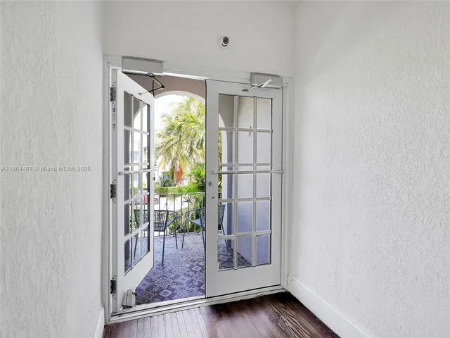 a view of entryway with wooden floor