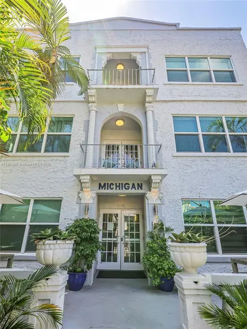 a view of a building with potted plants
