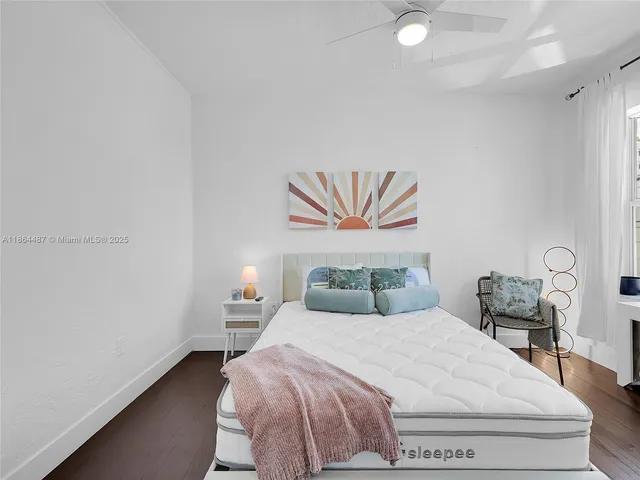 a bedroom with a bed and a table