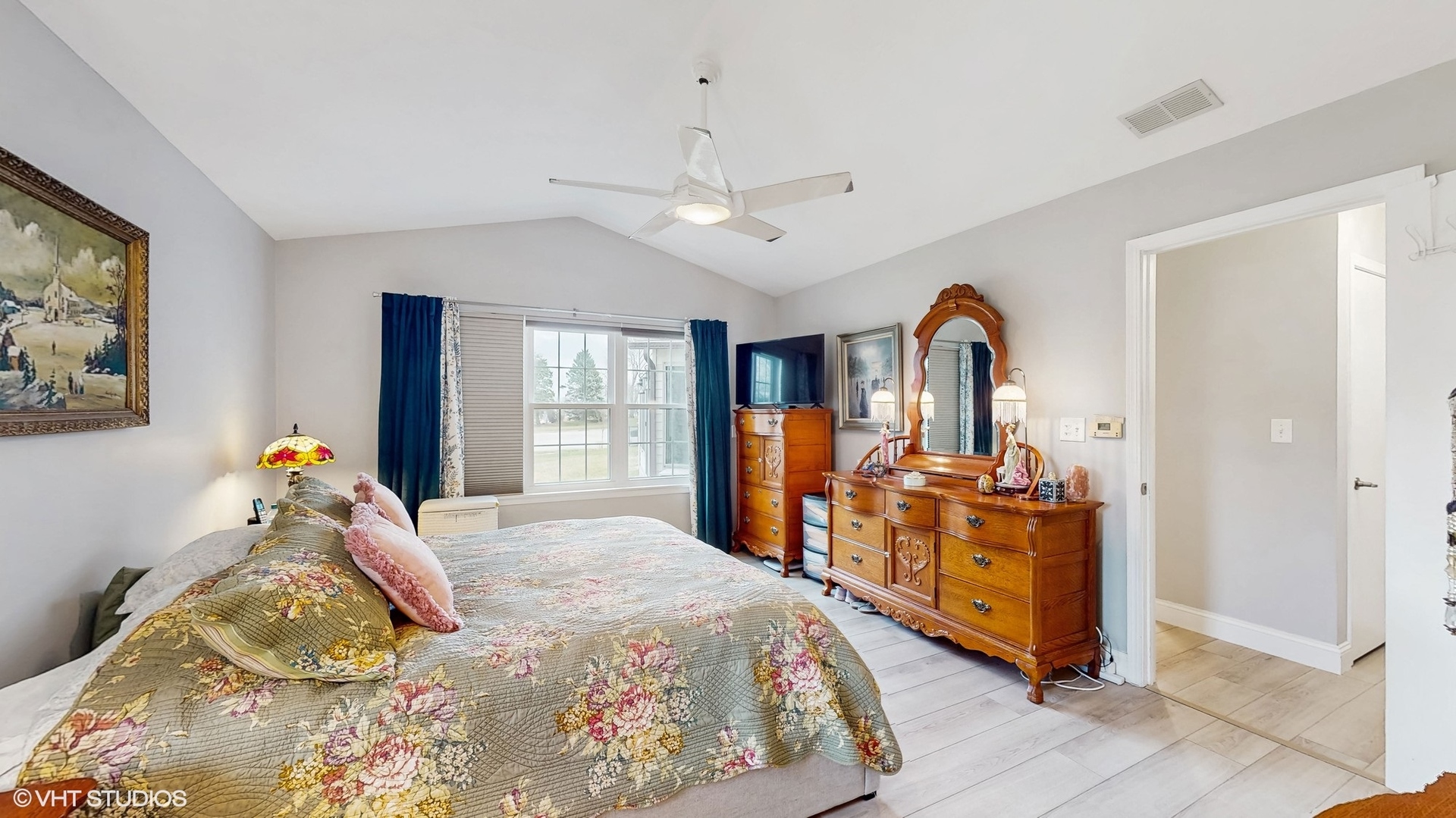 21202 Silktree Circle Plainfield, IL 60544 - Photo 15 of 25 a bedroom with a bed a dresser and large windows