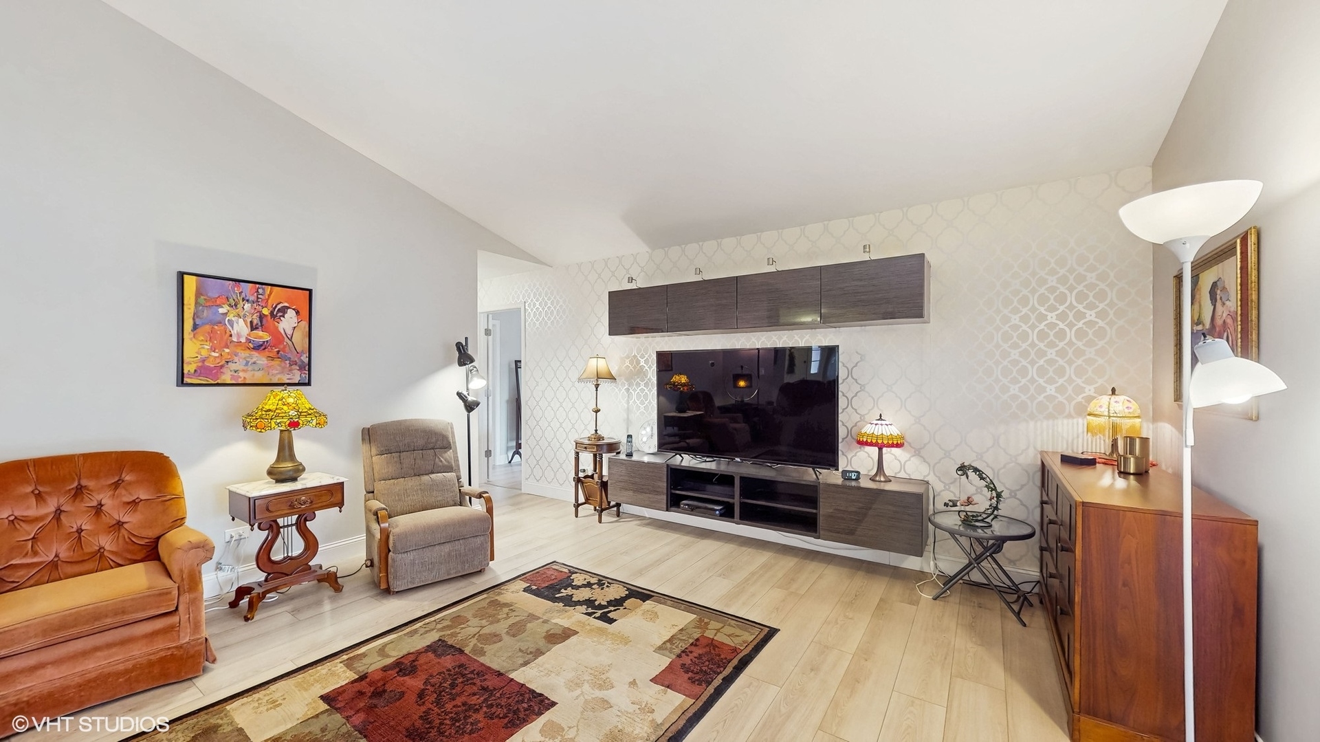 21202 Silktree Circle Plainfield, IL 60544 - Photo 2 of 25 a living room with furniture and a flat screen tv