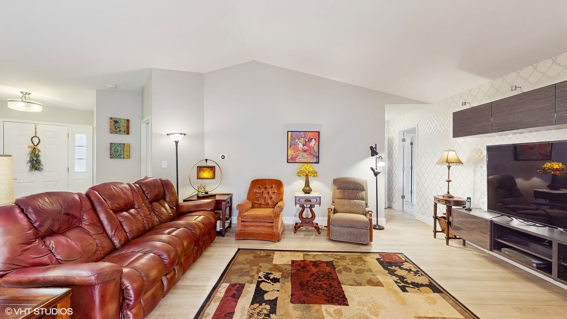 21202 Silktree Circle Plainfield, IL 60544 - Photo 4 of 25 a living room with furniture and a flat screen tv