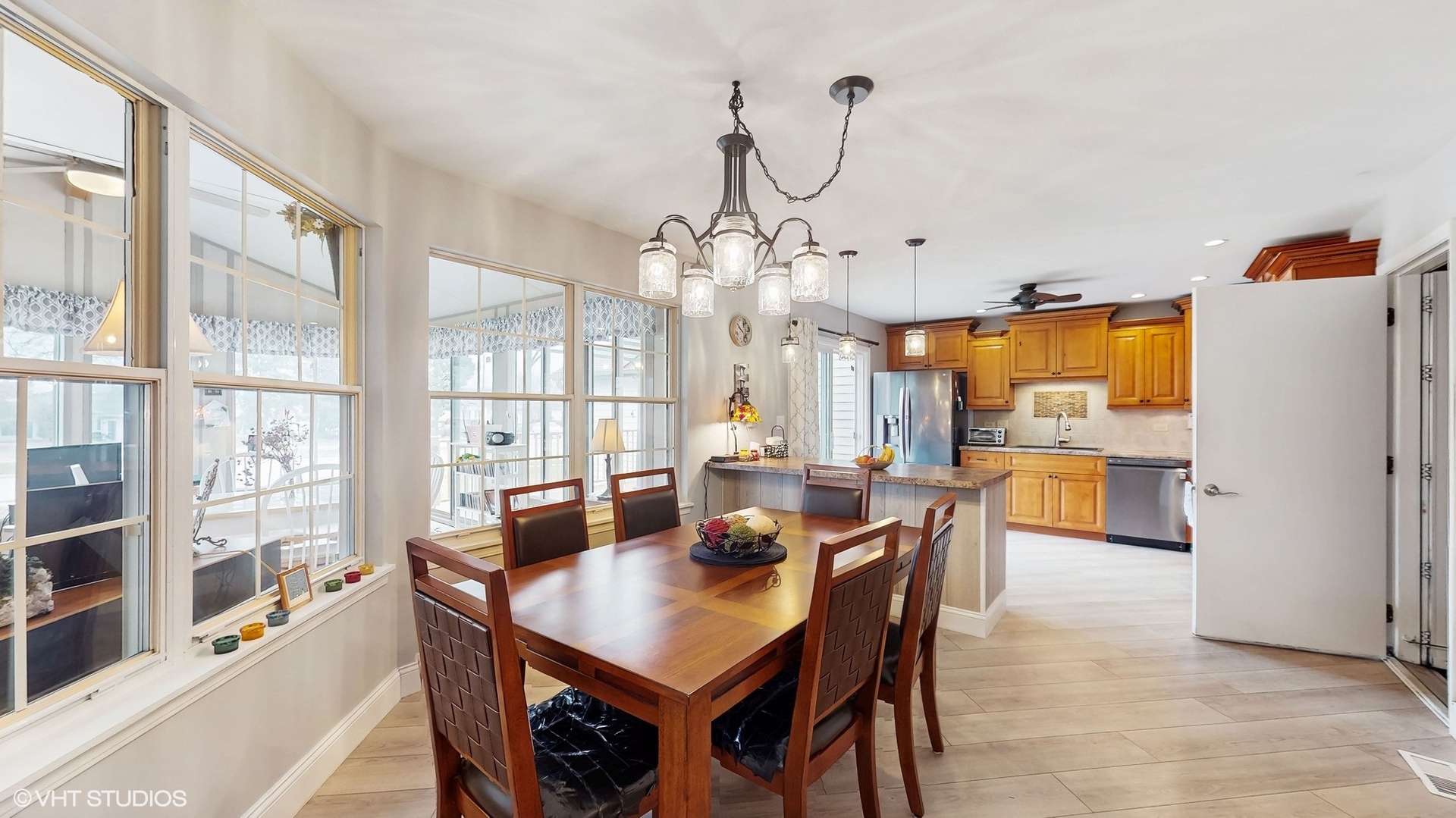 21202 Silktree Circle Plainfield, IL 60544 - Photo 5 of 25 a view of a dining room with furniture window and wooden floor