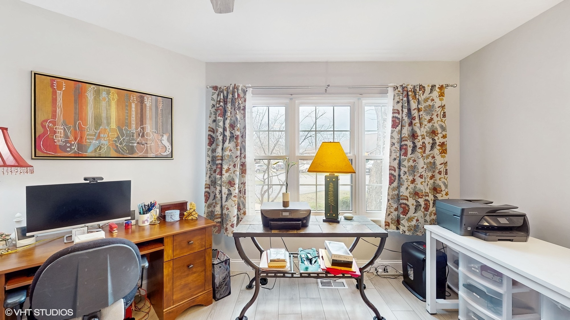 21202 Silktree Circle Plainfield, IL 60544 - Photo 10 of 25 a view of a workspace with furniture and a flat screen tv