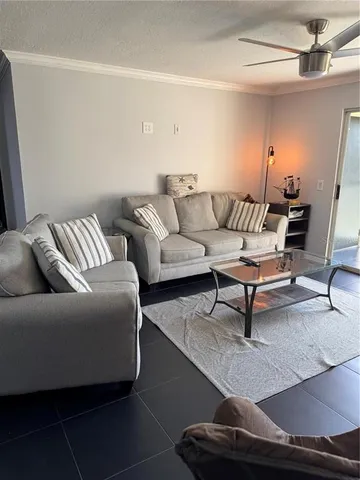 a living room with furniture and a rug