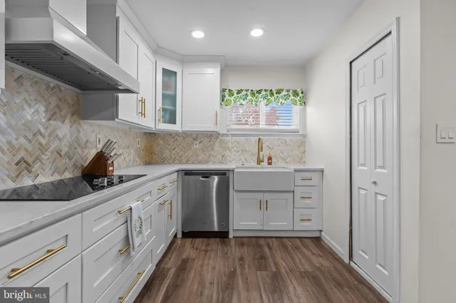 a kitchen with sink cabinets and window