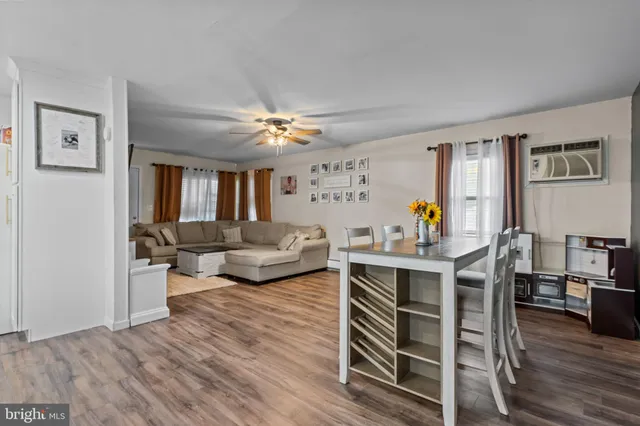 a view of a livingroom with furniture and wooden floor