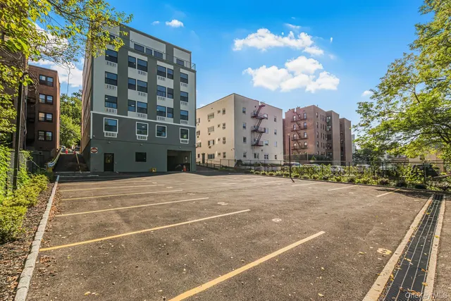 a view of a building with a road