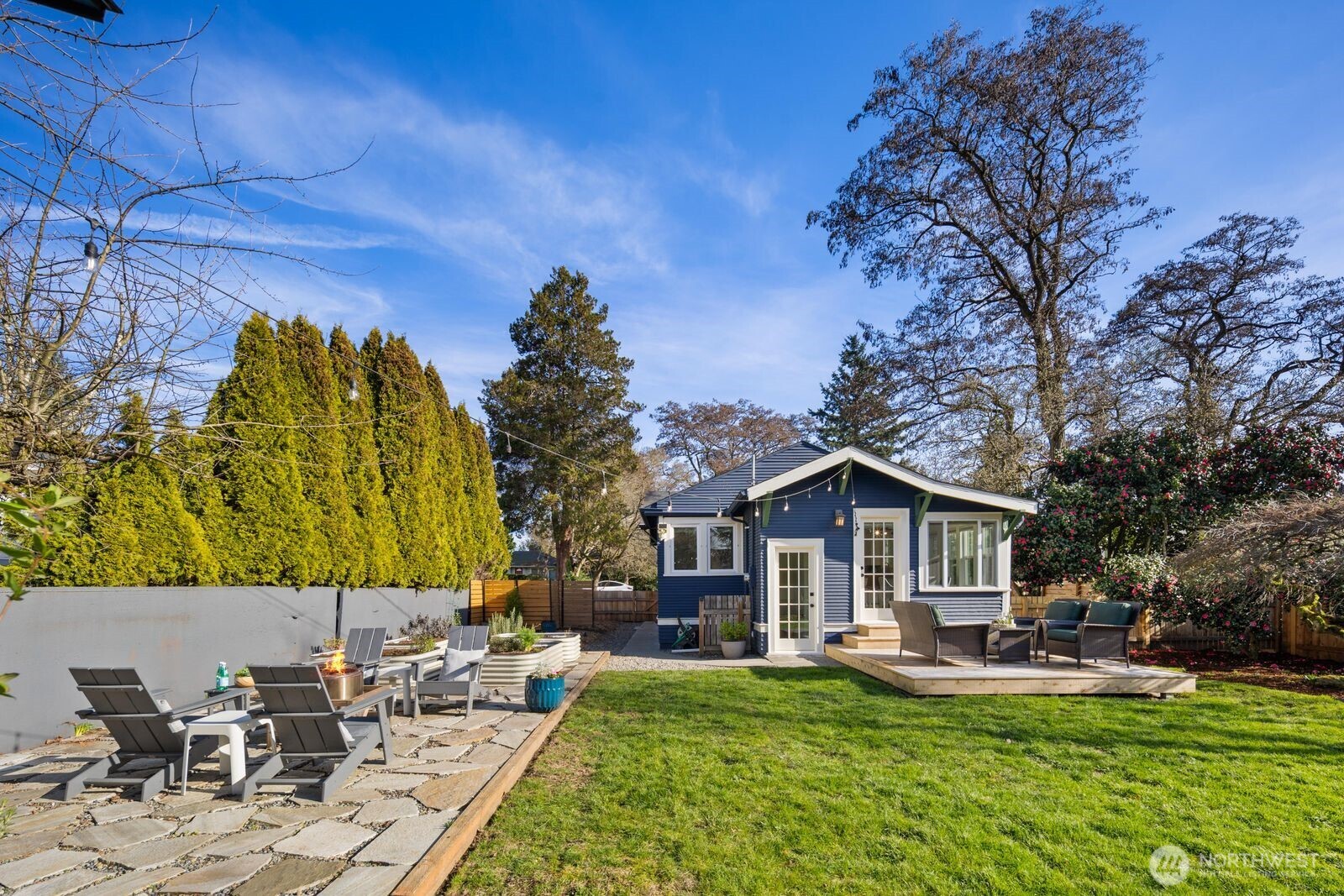 7941 30th Avenue Southwest Seattle, WA 98126 - Photo 32 of 37 a view of a house with backyard porch and sitting area