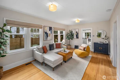 a living room with furniture and a rug