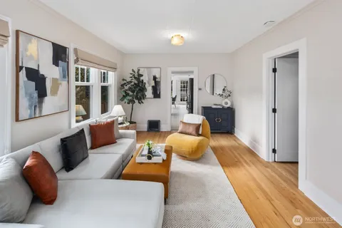a bedroom with furniture and wooden floor