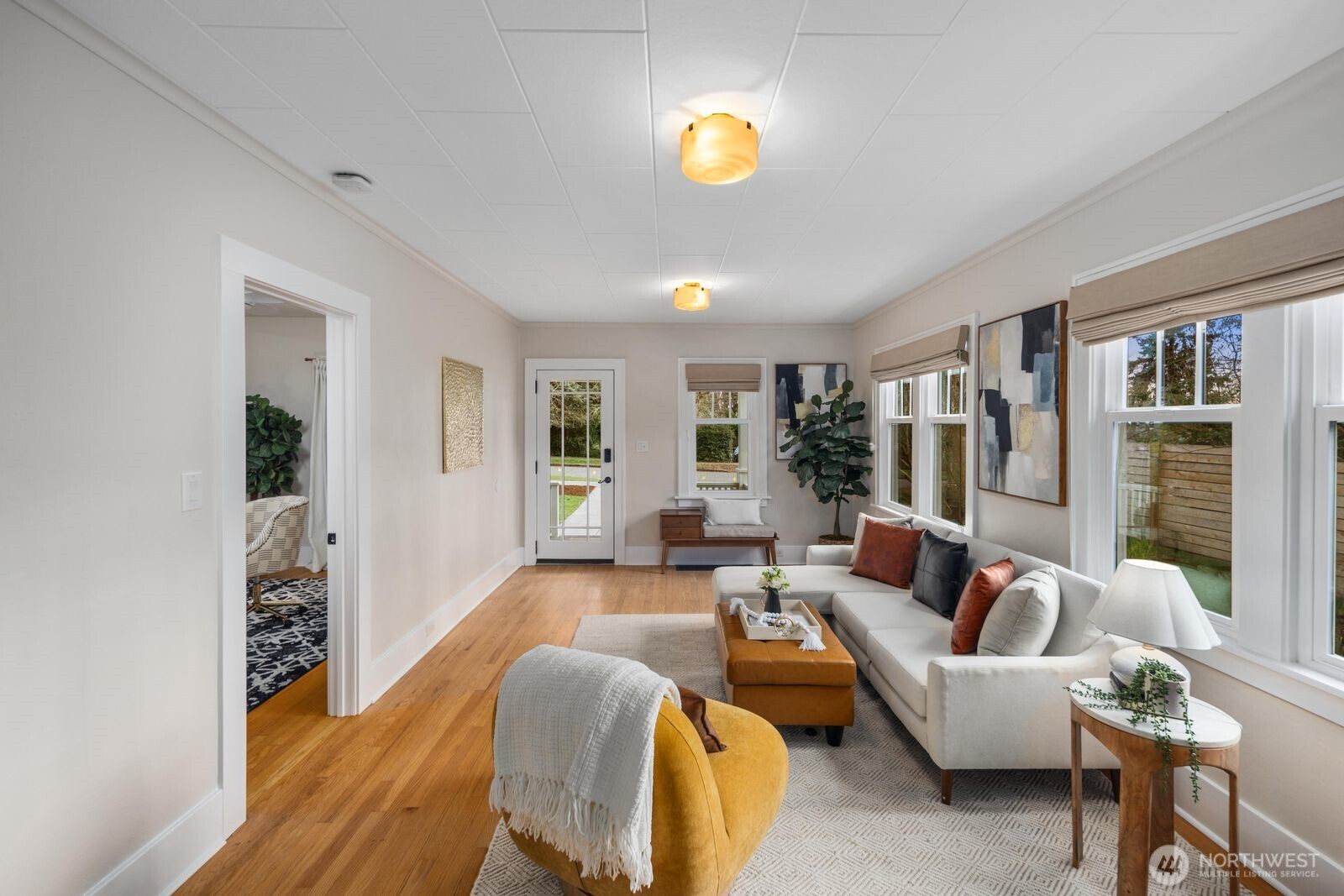 7941 30th Avenue Southwest Seattle, WA 98126 - Photo 9 of 37 a living room with furniture and a potted plant