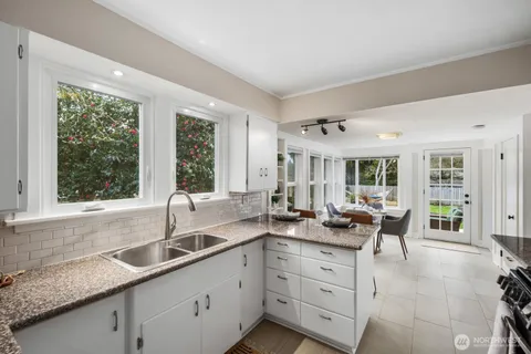 a very nice looking living room with a large window