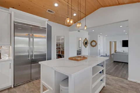 a view of kitchen island and living room