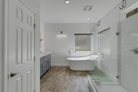 a bathroom with a sink toilet and shower