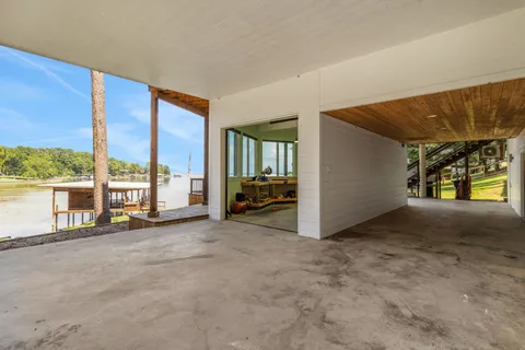 a view of an empty room with a floor to ceiling window and a room
