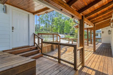 a view of outdoor space with wooden floor and outdoor seating