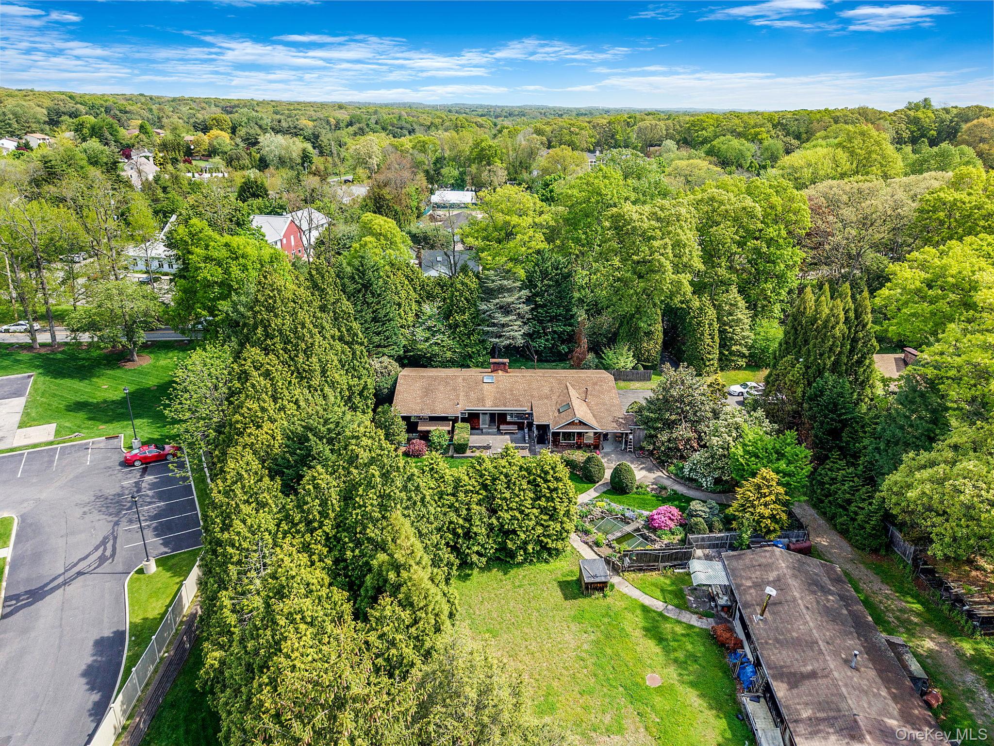 280 Deforest Road North Dix Hills, NY 11746 - Photo 7 of 37 an aerial view of a house with a yard