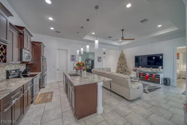 a kitchen that has a lot of cabinets in it and appliances