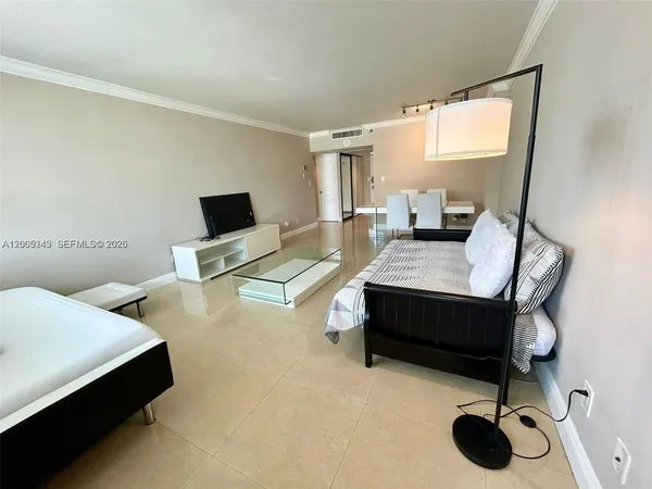 a bedroom with a bed and a desk