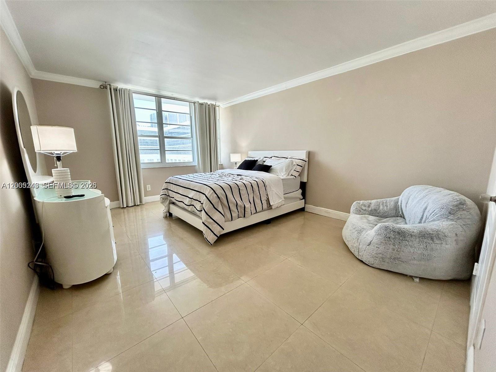 100 Lincoln Road, Unit 1010 Miami Beach, FL 33139 - Photo 6 of 12 a living room with furniture and a window