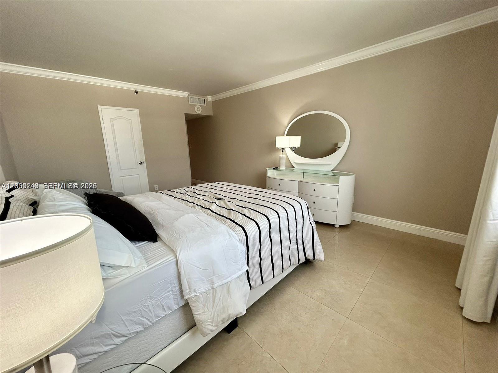 100 Lincoln Road, Unit 1010 Miami Beach, FL 33139 - Photo 7 of 12 a bedroom with a bed and window
