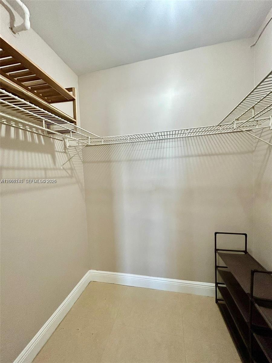 100 Lincoln Road, Unit 1010 Miami Beach, FL 33139 - Photo 8 of 12 a view of a room with racks on the wall