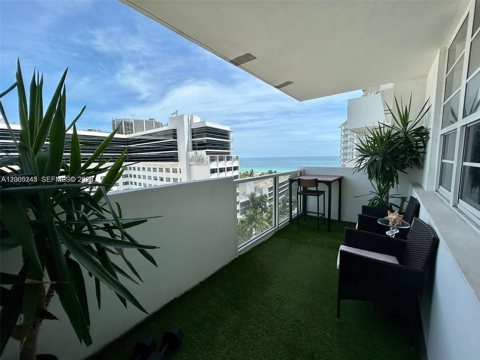 100 Lincoln Road, Unit 1010 Miami Beach, FL 33139 - Photo 10 of 12 a backyard of a house with seating space
