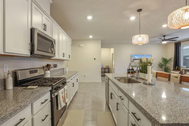a kitchen with a dining table and chairs