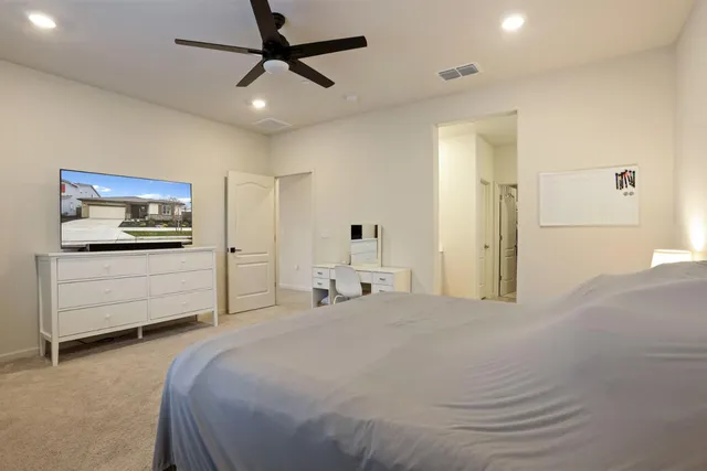 a bathroom with double vanity sinks and a mirror