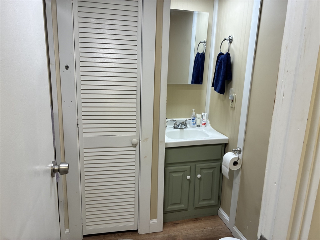 559 Tea Street, Unit 1 Charlemont, MA 01339 - Photo 11 of 14 a bathroom with a sink and a mirror