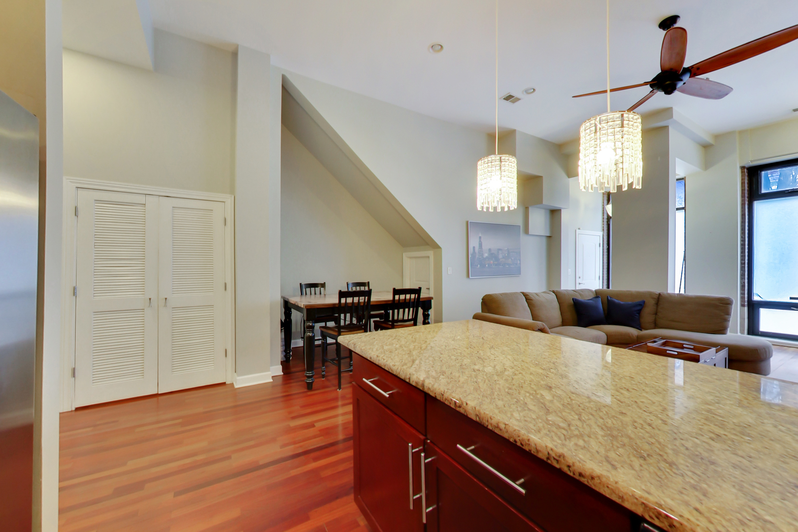2122 West Rice Street, Unit 1 Chicago, IL 60622 - Photo 11 of 22 a large kitchen with kitchen island a stove a sink a dining table and chairs