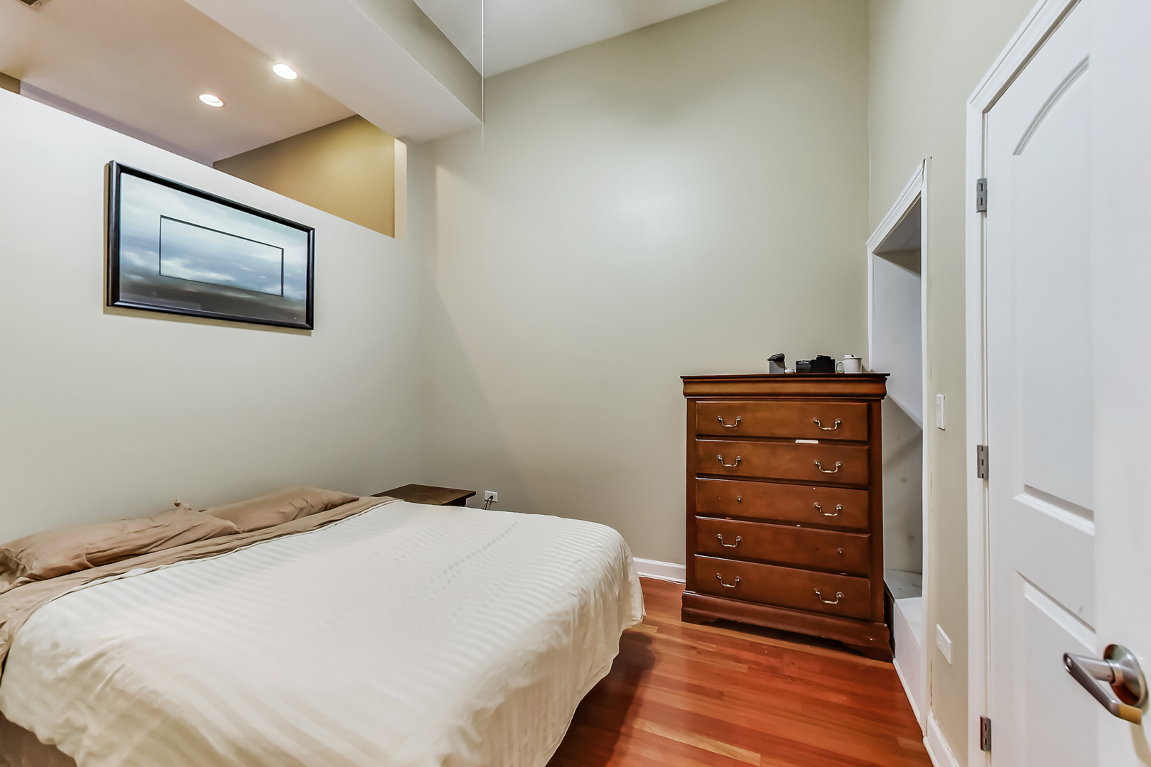 2122 West Rice Street, Unit 1 Chicago, IL 60622 - Photo 15 of 22 a bedroom with a bed and a dresser