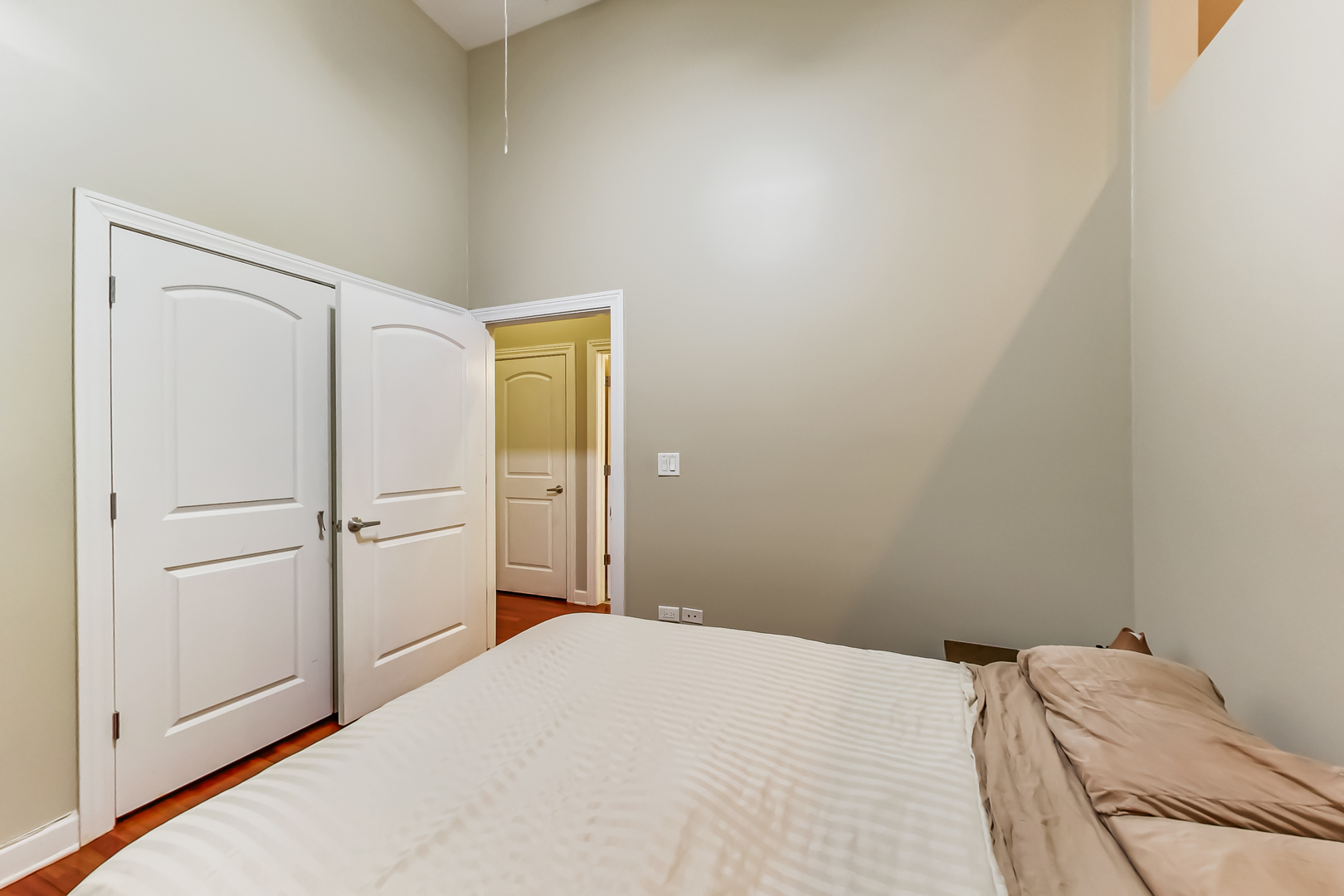 2122 West Rice Street, Unit 1 Chicago, IL 60622 - Photo 17 of 22 a bedroom with a bed and cabinets