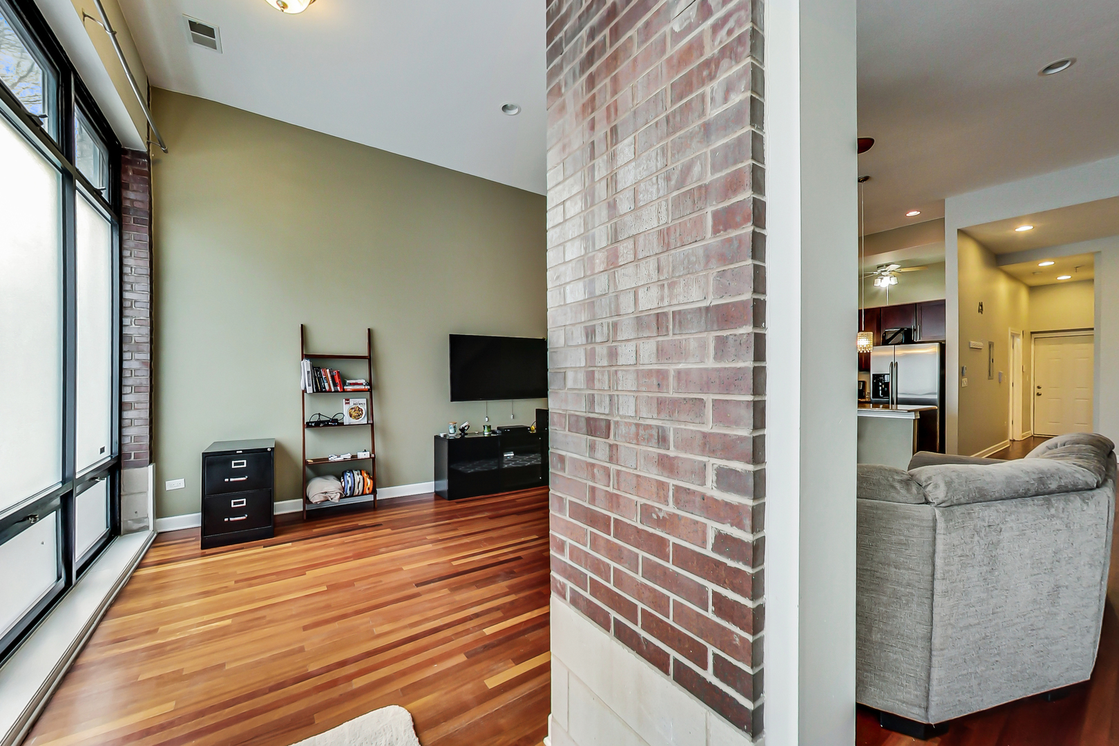 2122 West Rice Street, Unit 1 Chicago, IL 60622 - Photo 21 of 22 a living room with furniture and a flat screen tv