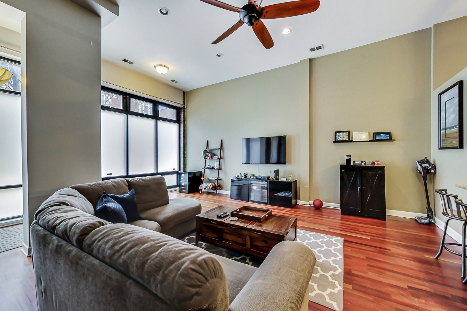 2122 West Rice Street, Unit 1 Chicago, IL 60622 - Photo 5 of 22 a living room with furniture or couch and a flat screen tv