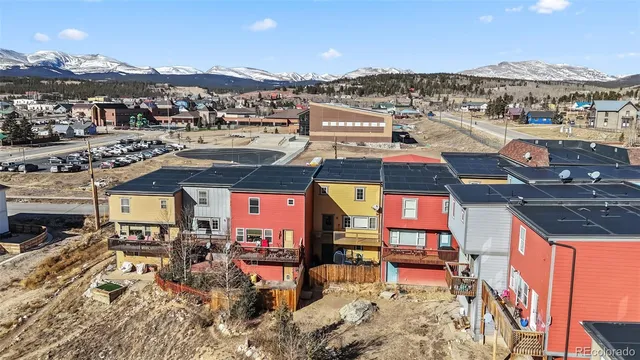 an aerial view of a houses with a swimming pool
