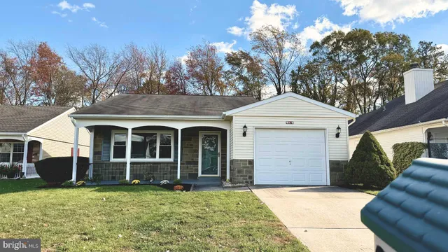 a front view of a house with yard